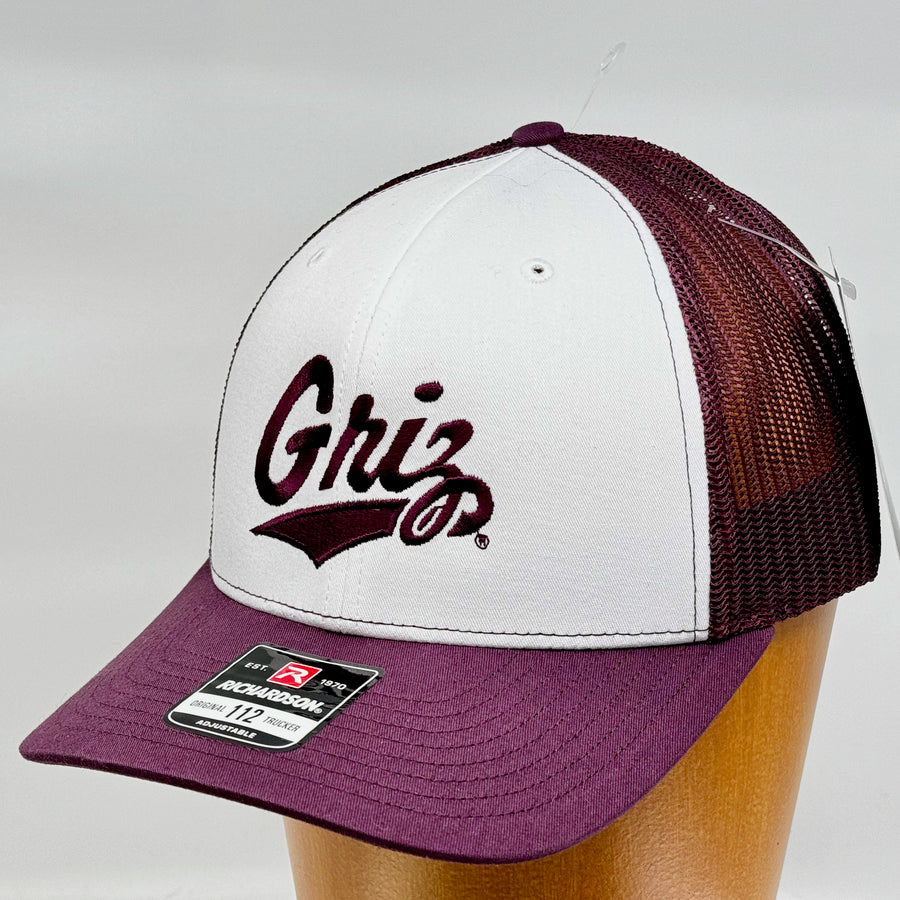 Blue Peak Creative's maroon and white Richardson Trucker Hat with the University of MT Griz Script embroidered in maroon (3/4 view)