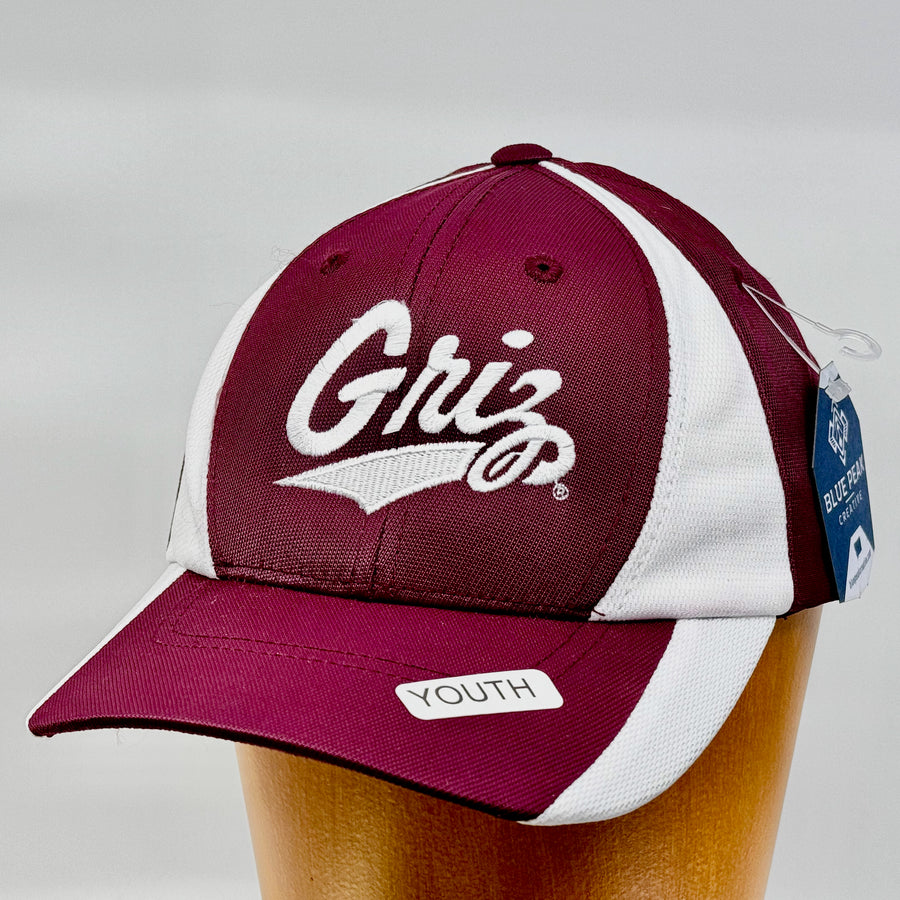 Blue Peak Creative's Youth maroon and white Sport Tek Two Tone Hat with the University of MT Griz Script embroidered in white (3/4 view)