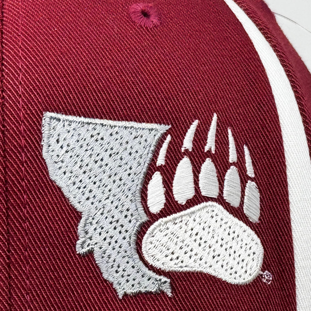 Blue Peak Creative's maroon and white Flexfit Front Sweep Hat embroidered with the Montana Grizzlies Paw design in silver and white (detail)
