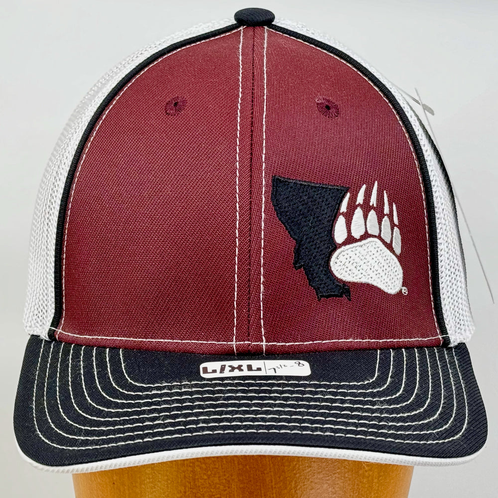 Blue Peak Creative's maroon, black, and white Trucker Pacflex Hat embroidered with the Montana Grizzlies Paw design in black and white (front view)