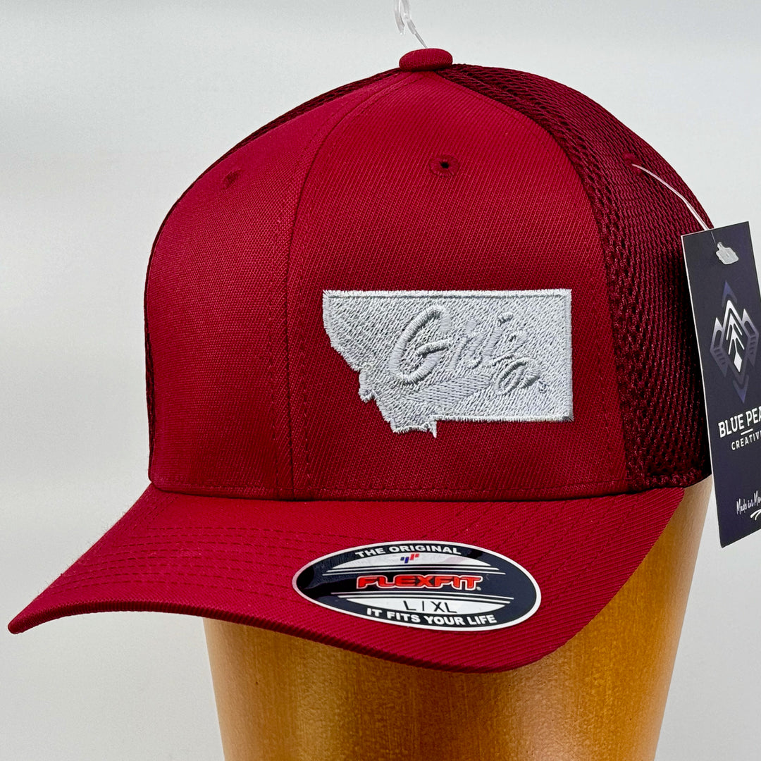 Blue Peaks Creative's maroon Ultrafibre and Airmesh Hat embroidered with the Griz over Montana design in silver (3/4 view)