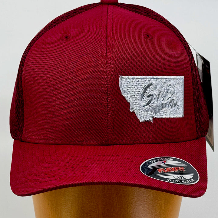 Blue Peaks Creative's maroon Ultrafibre and Airmesh Hat embroidered with the Griz over Montana design in silver (front view)