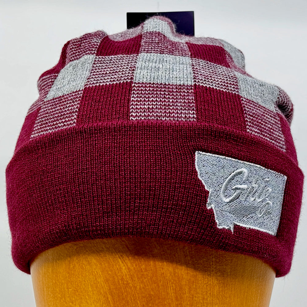 Blue Peaks Creative's grey and maroon USA-Made Plaid Beanie embroidered with the University of MT Griz Script over the state of Montana in silver (front view)
