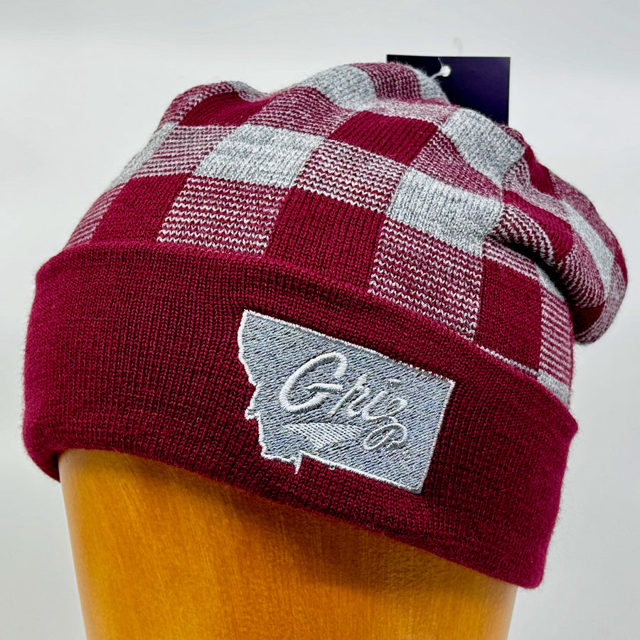 Blue Peaks Creative's grey and maroon USA-Made Plaid Beanie embroidered with the University of MT Griz Script over the state of Montana in silver (3/4 view)