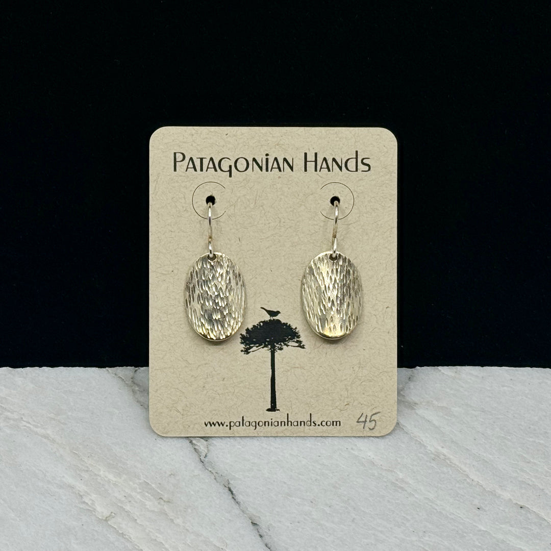 Pair of Patagonian Hands's Fine Silver (.999) Oval Textured Earrings with Sterling Silver (.925) Wires, on card