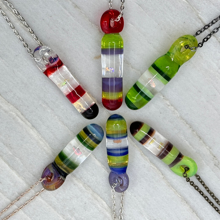 Six Hand Blown Glass and Opal Pendants by Blue Flame Glass on assorted metal chains