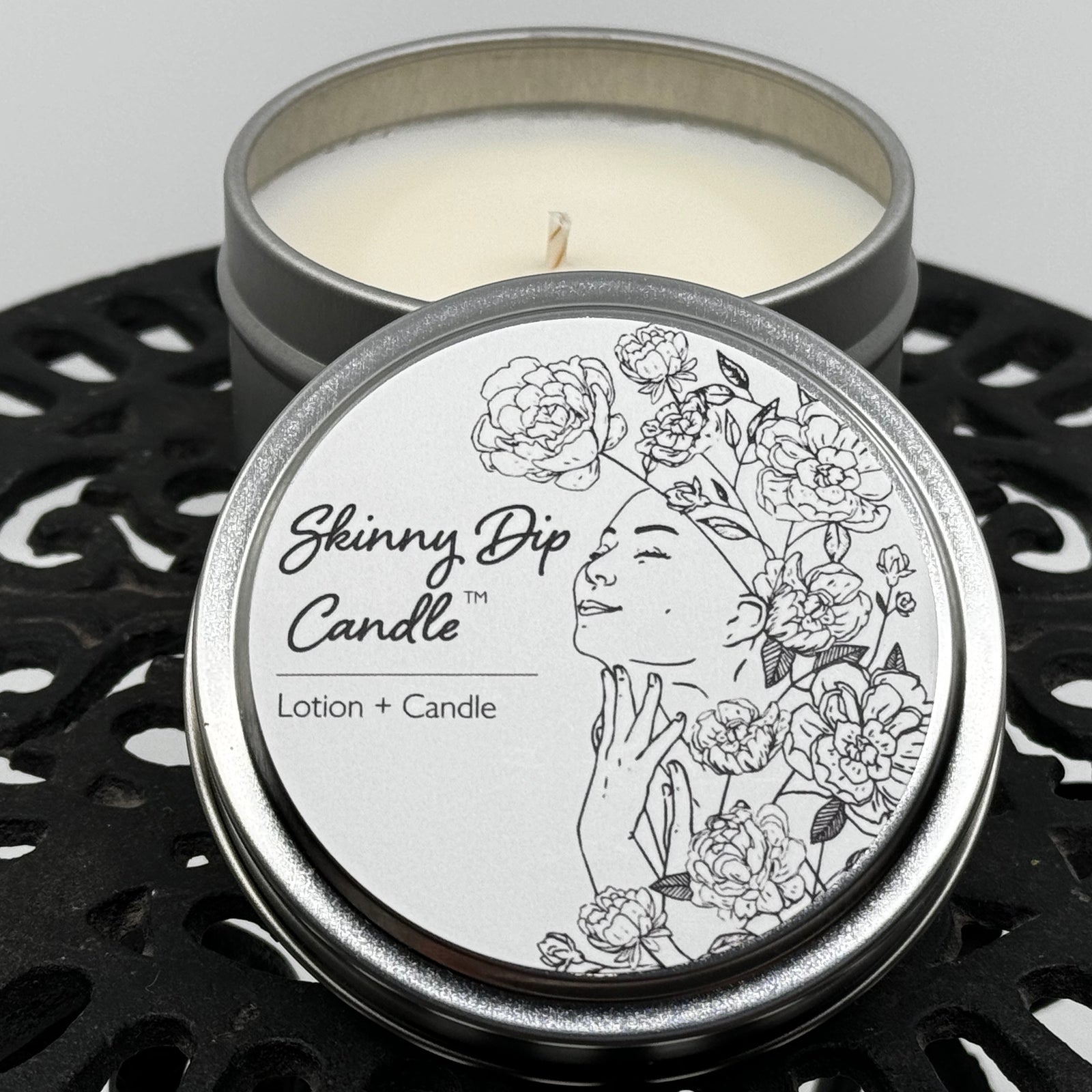 4 oz. tin of Skinny Dip Candle's Herb 'n Scotch Lotion Candle, lid and inside