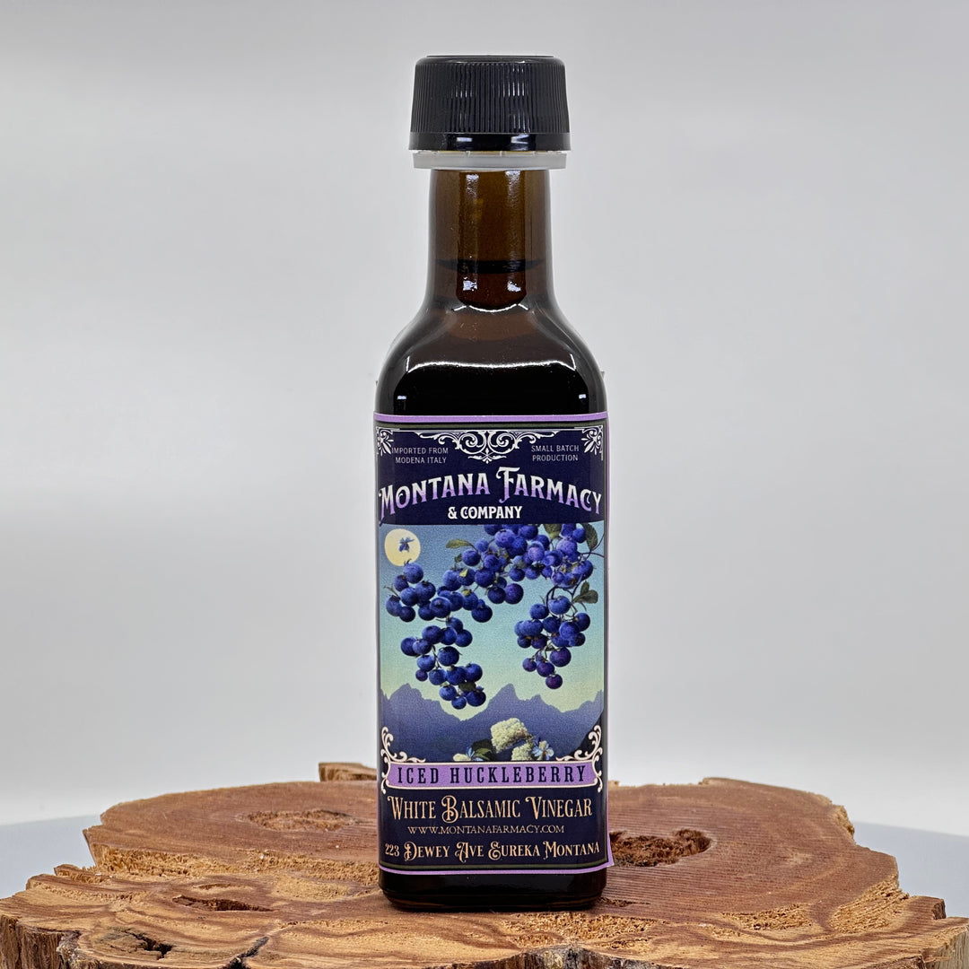 100 ml bottle of Montana Farmacy & Co.'s Iced Huckleberry White Balsamic Vinegar, front
