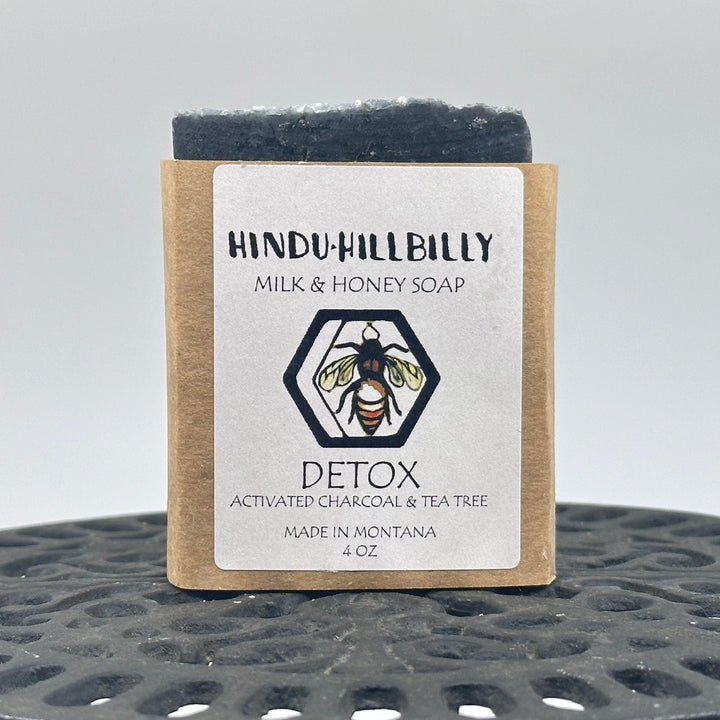 4 oz. bar of Hindu Hillbilly Detox Activated Charcoal & Tea Tree Milk & Honey Soap, front