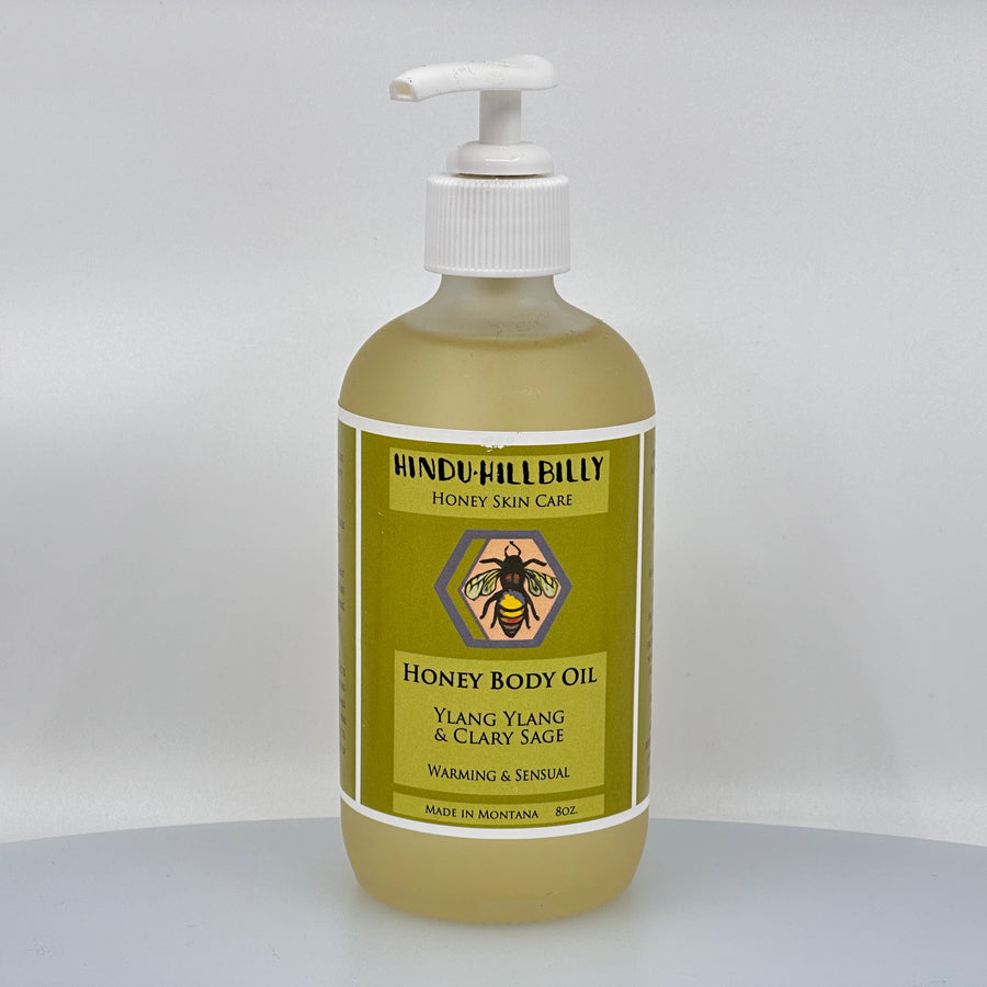 8 oz. bottle of Hindu Hillbilly's Ylang Ylang & Clary Sage Honey Body Oil, front