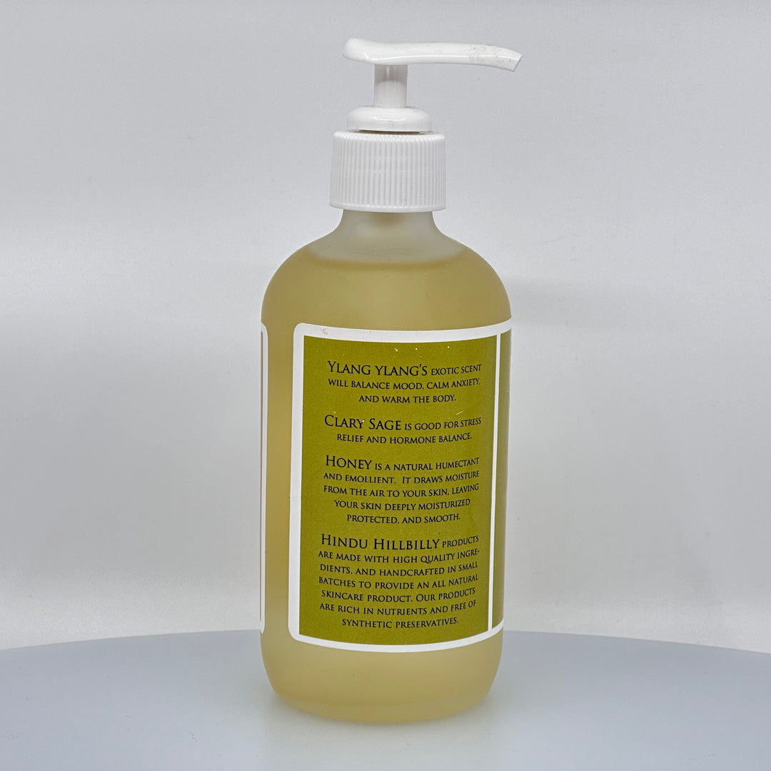 8 oz. bottle of Hindu Hillbilly's Ylang Ylang & Clary Sage Honey Body Oil, description