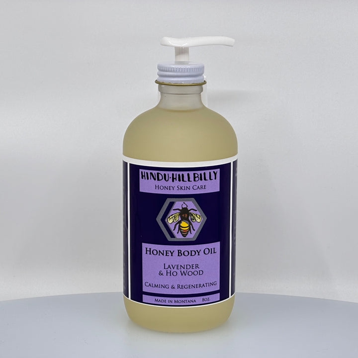 8 oz. bottle of Hindu Hillbilly's Lavender & Ho Wood Honey Body Oil, front