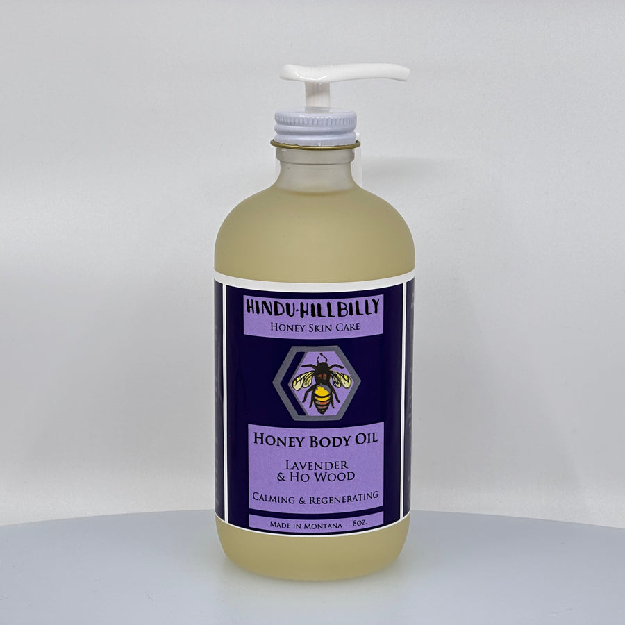 8 oz. bottle of Hindu Hillbilly's Lavender & Ho Wood Honey Body Oil, front