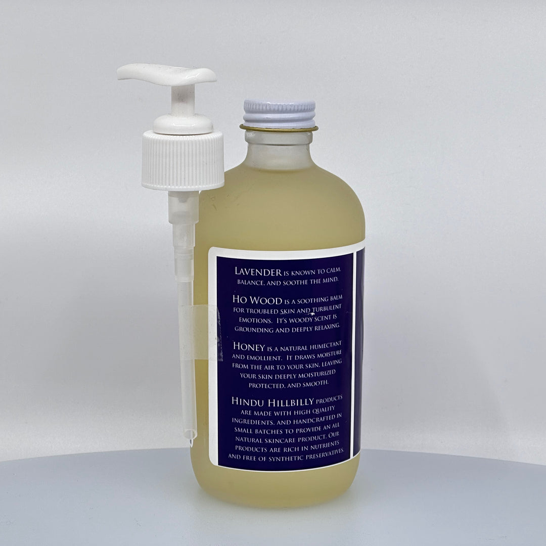 8 oz. bottle of Hindu Hillbilly's Lavender & Ho Wood Honey Body Oil, description