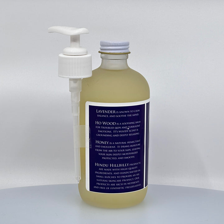 8 oz. bottle of Hindu Hillbilly's Lavender & Ho Wood Honey Body Oil, description