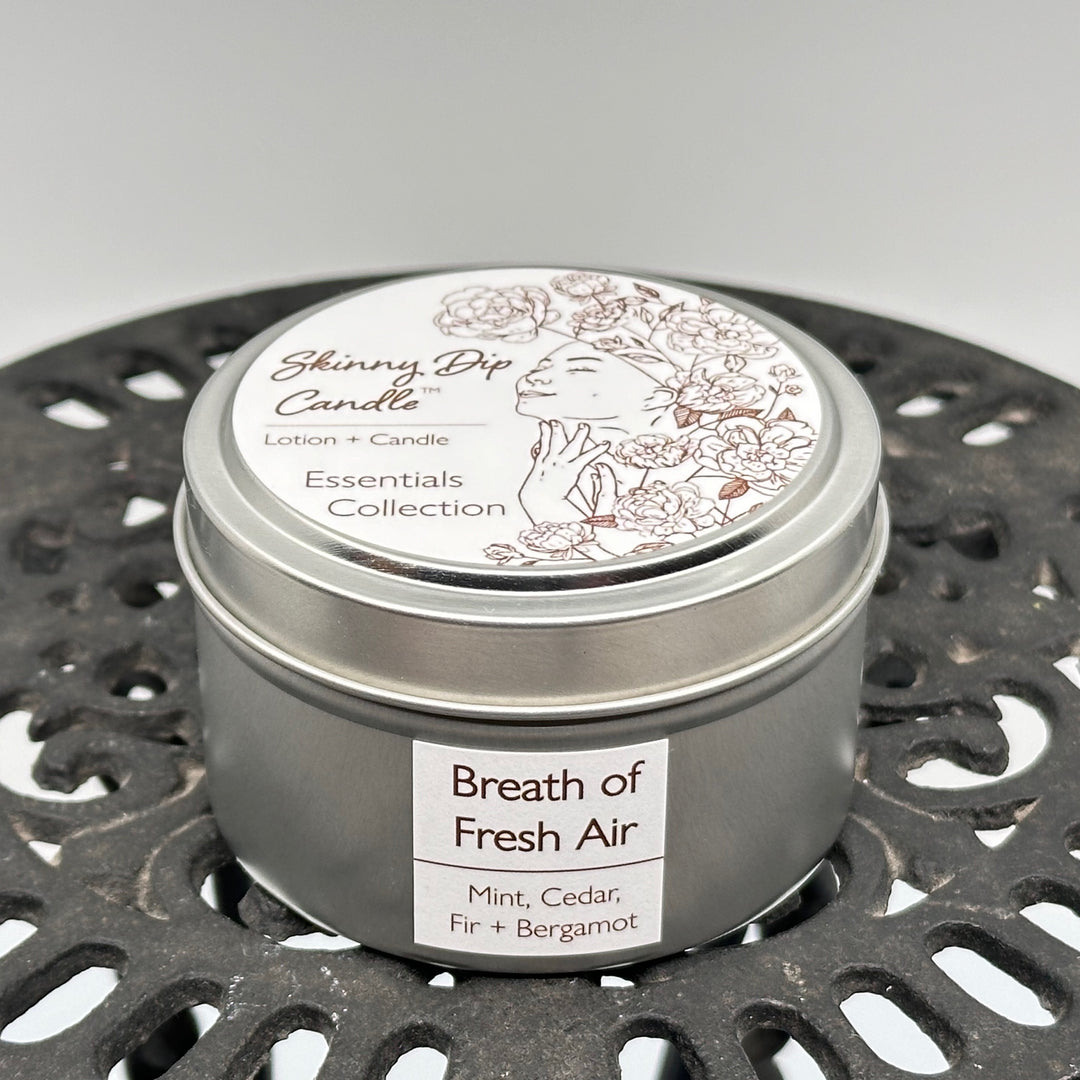 4 oz. tin of Skinny Dip Candle's Breath of Fresh Air (mint, cedar, fir & bergamot) Lotion + Candle, front