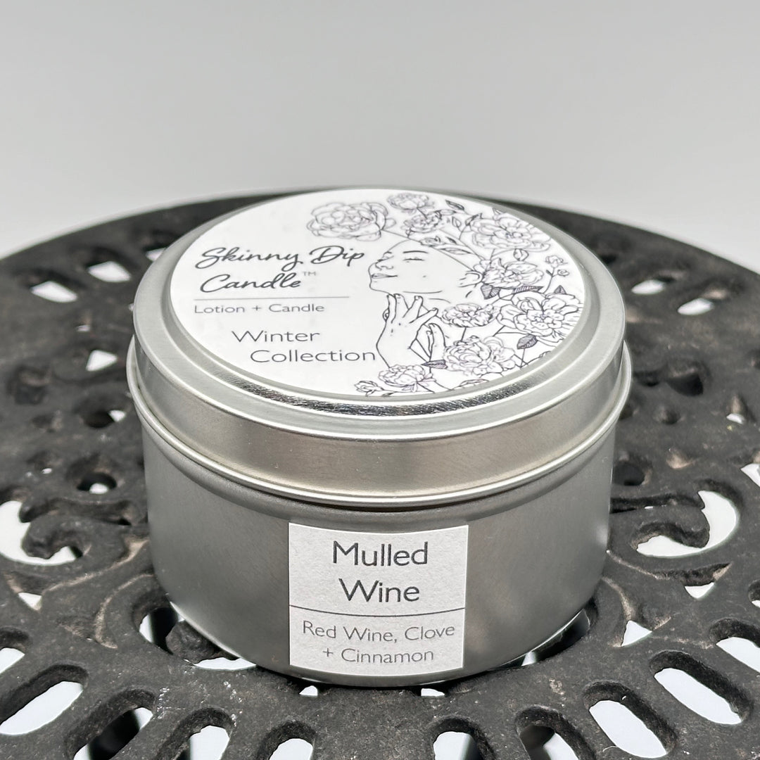 4 oz. tin of Skinny Dip Candle's Mulled Wine (red wine, clove & cinnamon) Lotion + Candle, front