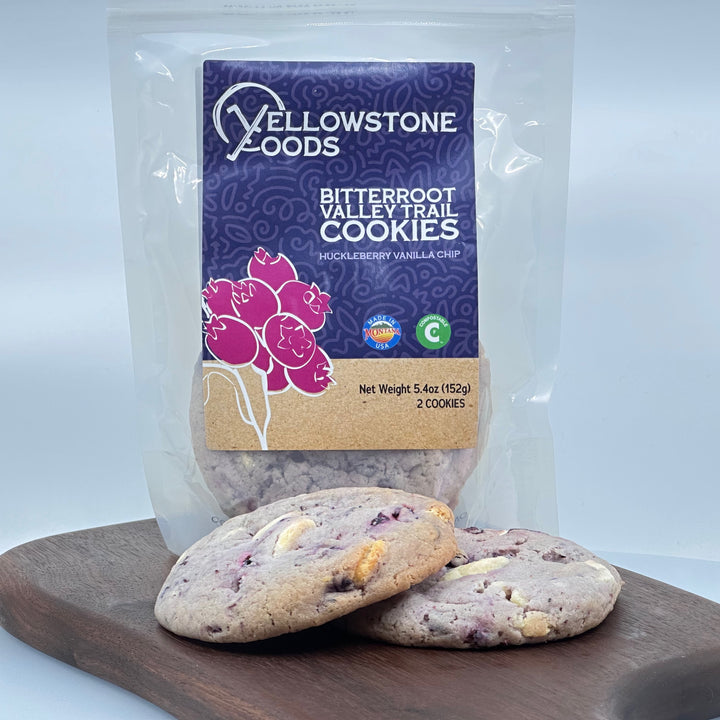 5.4 oz bag of Yellowstone Foods' Bitterroot Valley Trail Huckleberry Vanilla Chip cookies (2 cookies), front