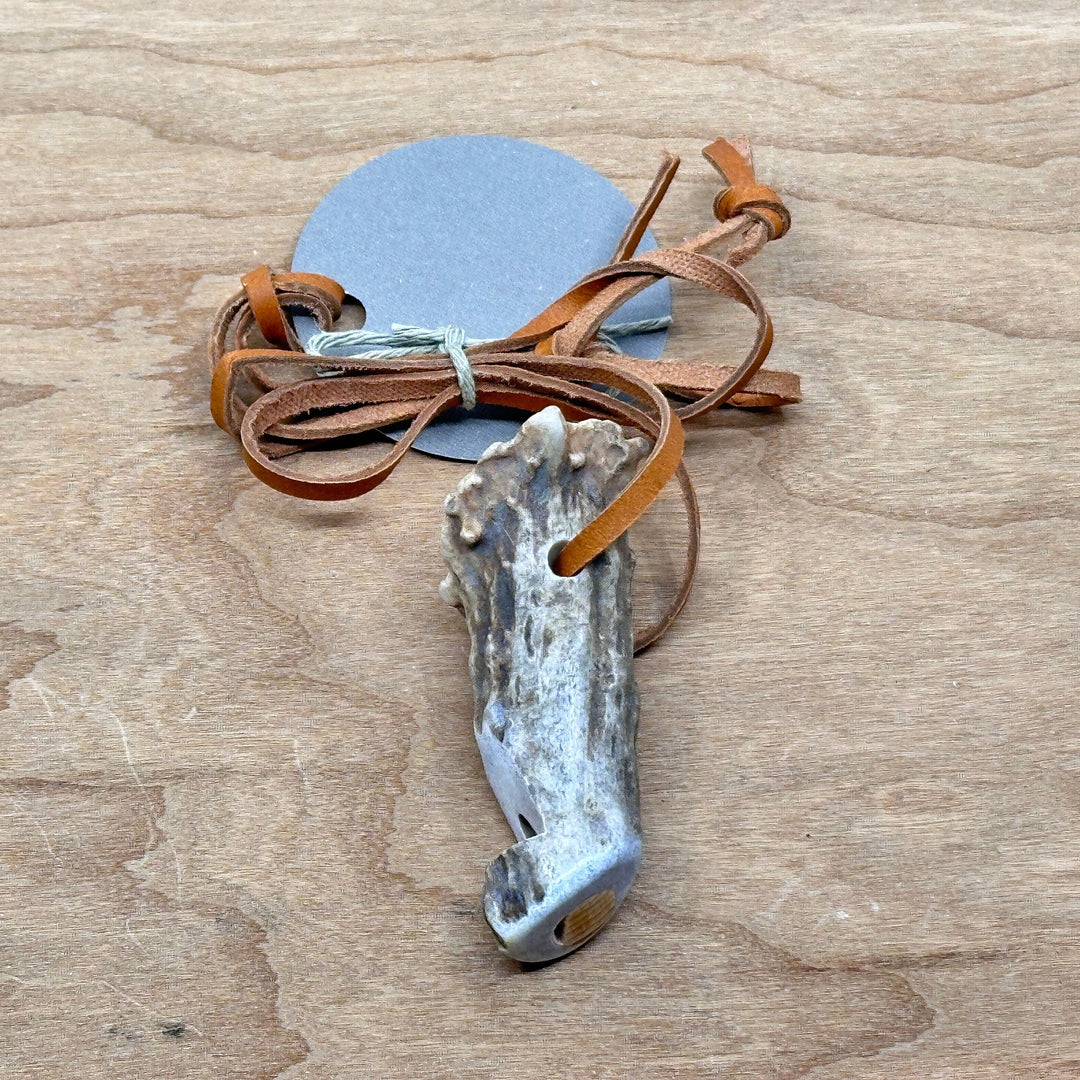 406 Antlery's natural antler whistle on a leather cord, side