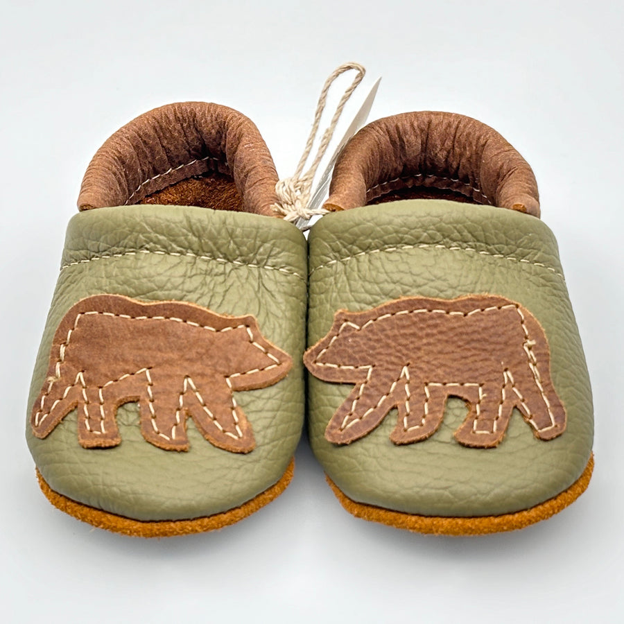 Pair of Starry Knight Design leather moccasins / baby booties, moss green with bear design, front
