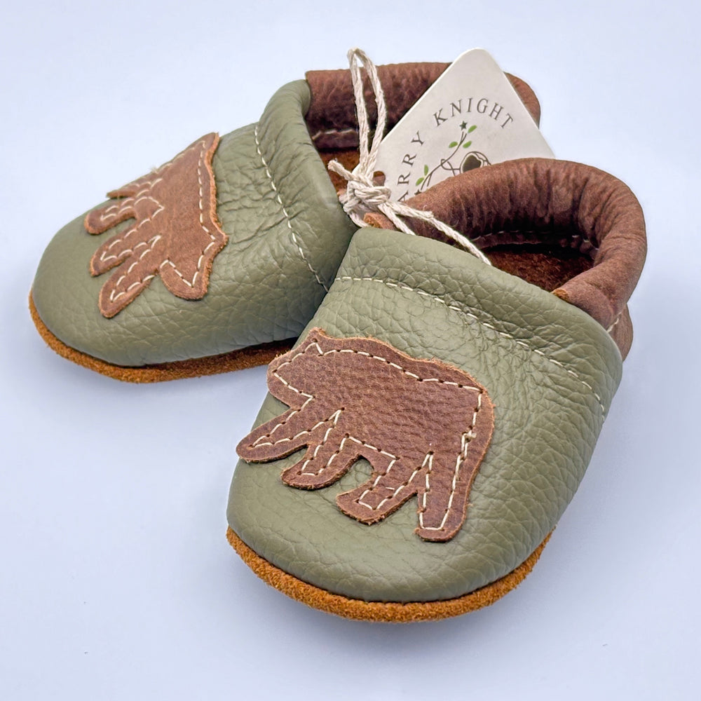 Pair of Starry Knight Design leather moccasins / baby booties, moss green with bear design, side