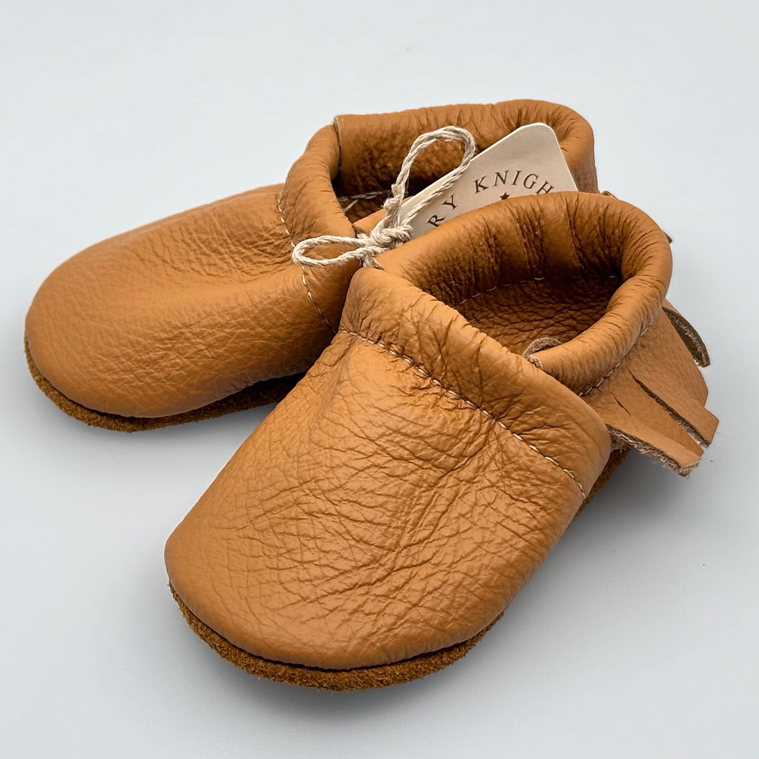 Pair of Starry Knight Design leather moccasins / baby booties, camel tan with fringe, side