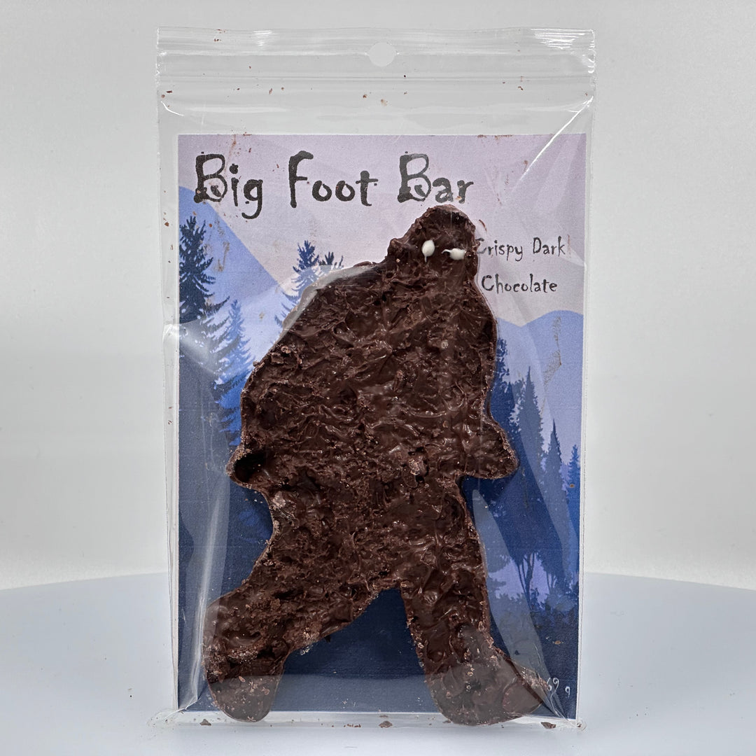 2 oz. bar of Lolo Sweets Barn Crispy Cryptids Dark Chocolate with puffed rice, in the shape of Bigfoot, front