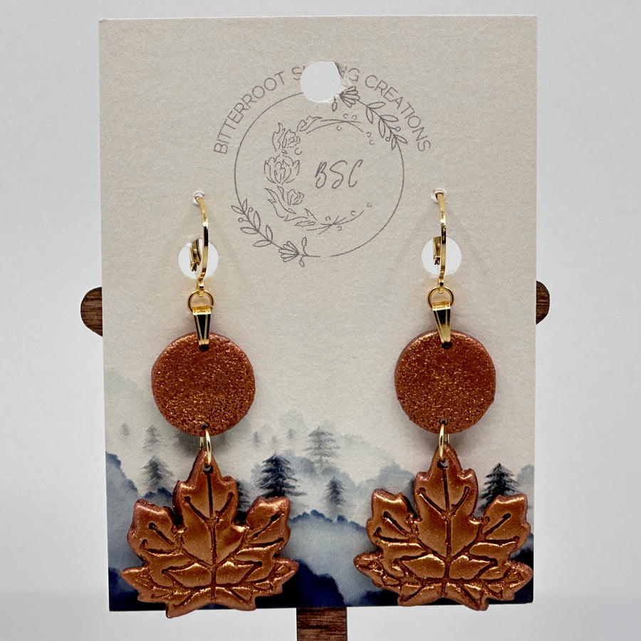 Bitterroot Shining Creations metallic Maple Leaf Earrings on card, copper color