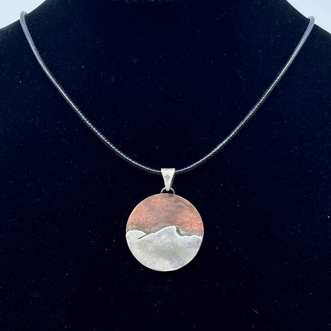 Bull & Bear's Copper and .925 Sterling Silver Montana Mountain Pendant, featuring Stuart Peak, on a black cord