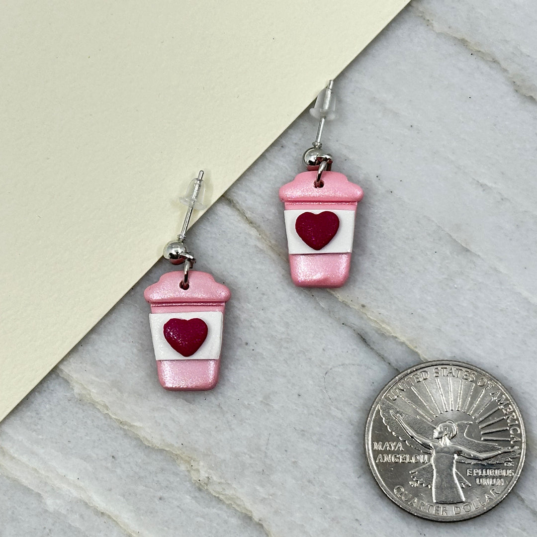 Pair of Bitterroot Shining Creations' Valentine Earrings (pink coffee cups), with scale