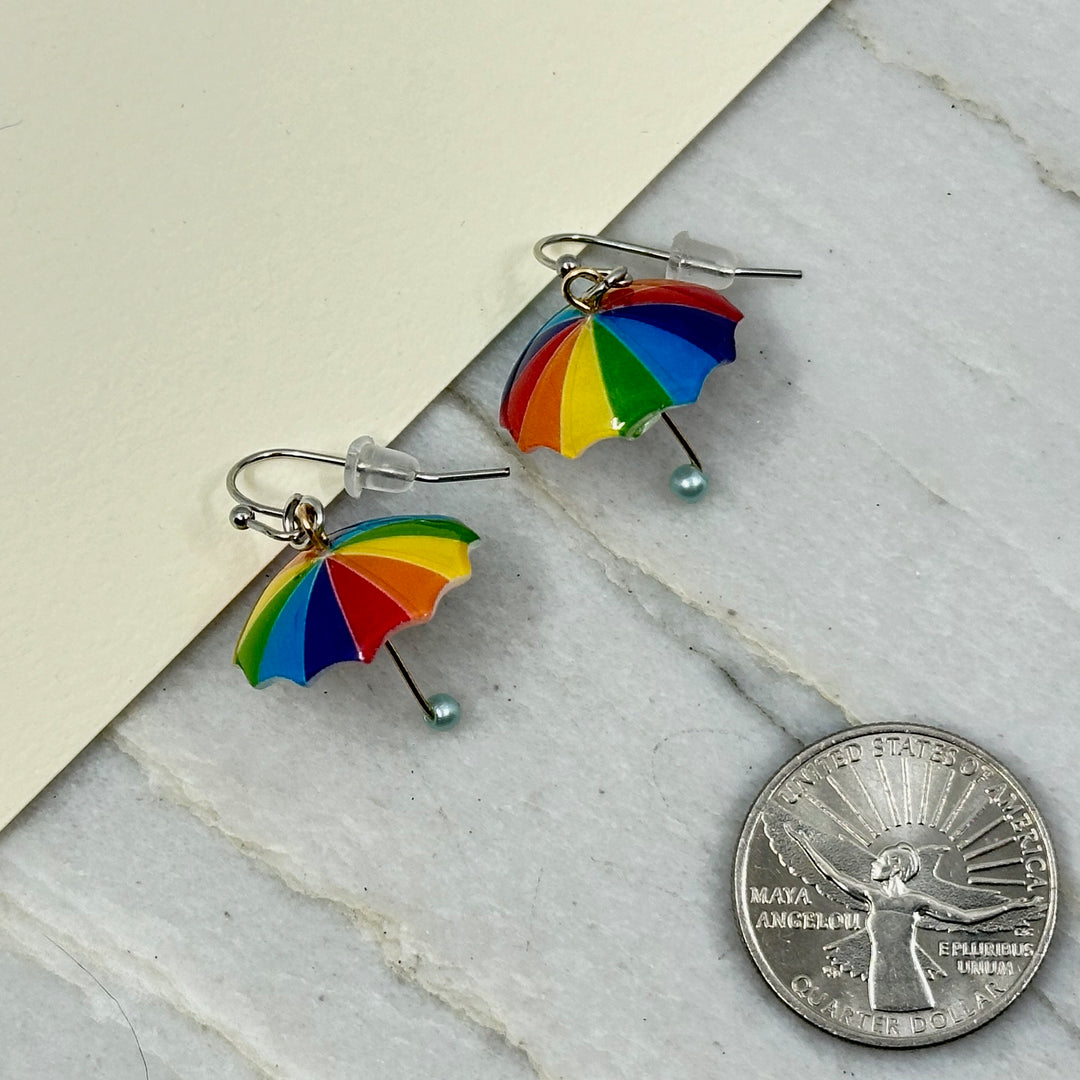 Pair of Rainbow Umbrella Earrings with Stainless Steel Wires by Woodland Goth Creations, scale