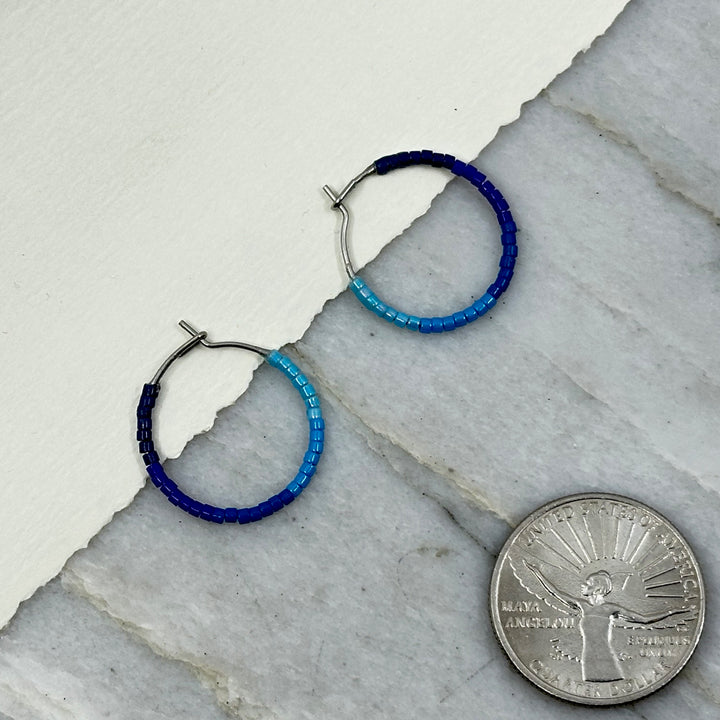 Pair of Aurum Shimmer's Beaded Stainless Steel Hoop Earrings (blues), with scale