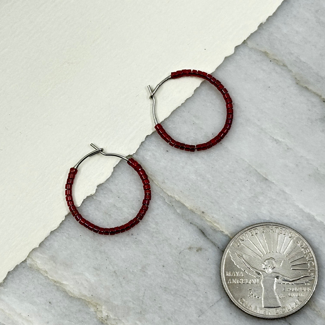 Pair of Aurum Shimmer's Beaded Stainless Steel Hoop Earrings (red), with scale