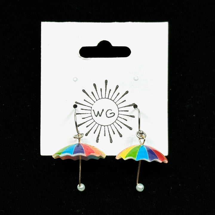 Pair of Rainbow Umbrella Earrings with Stainless Steel Wires by Woodland Goth Creations, on card