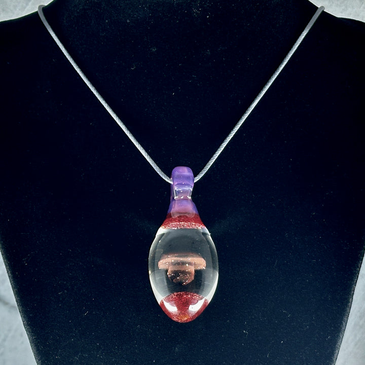 Hand Blown Mushroom Pendant (borosilicate lampwork) by Blue Flame Glass on cord (single mushroom, black cap, purple and red), hanging