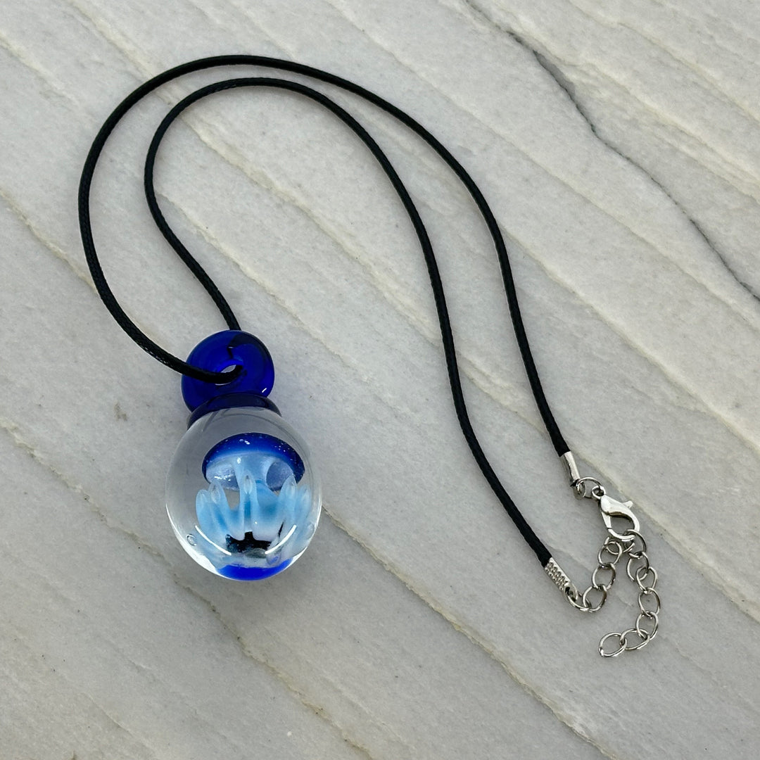 Hand Blown Mushroom Pendant (borosilicate lampwork) by Blue Flame Glass on cord (single mushroom, blue cap blue grass)