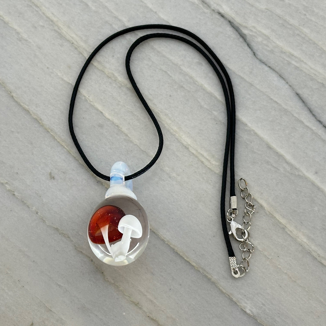 Hand Blown Mushroom Pendant (borosilicate lampwork) by Blue Flame Glass on cord (2 mushrooms, white cap and red cap)