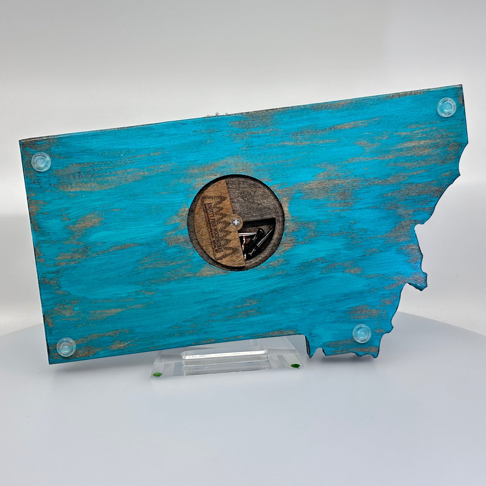 Knotty Pine Woodworks Handmade Montana Trout Cribbage Board Turquoise (back)—this handmade wooden cribbage board is the perfect Montana-made gift for game lovers and fishers. The back features a compartment for storing metal pegs.