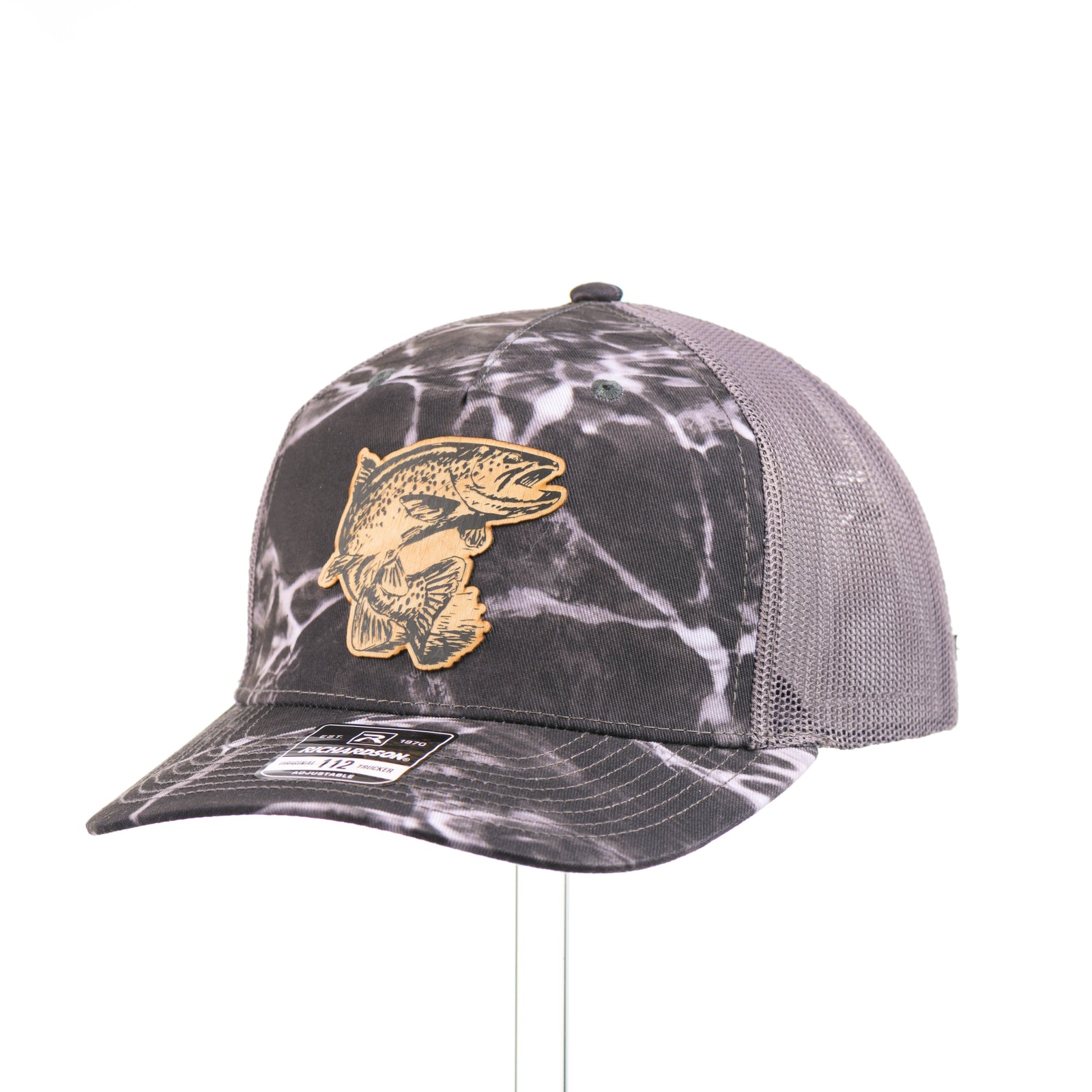 Flexwood Jumping Trout Richardson Trucker Cap featuring a premium flexwood patch in the shape of a jumping trout, handmade in Montana, USA by Last Best Supply Co.