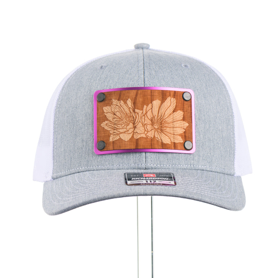 Heather Grey and white richardson hat with a Bitterroot wood and metal patch.