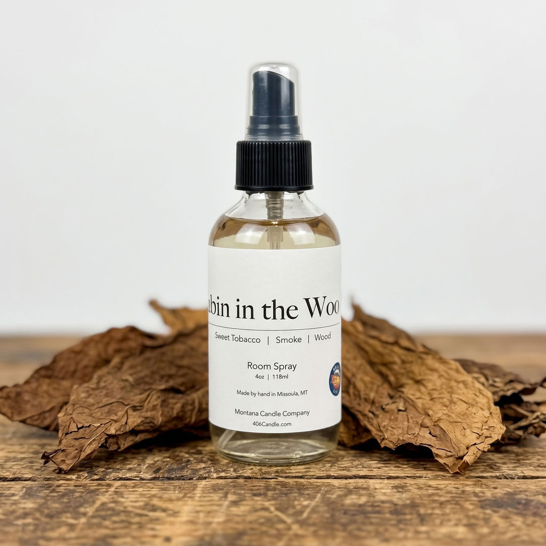 Experience cozy mountain vibes with Cabin in the Woods Room Spray by Montana Candle Company. Notes of sweet tobacco, smoke, and wood. Handcrafted in MT!