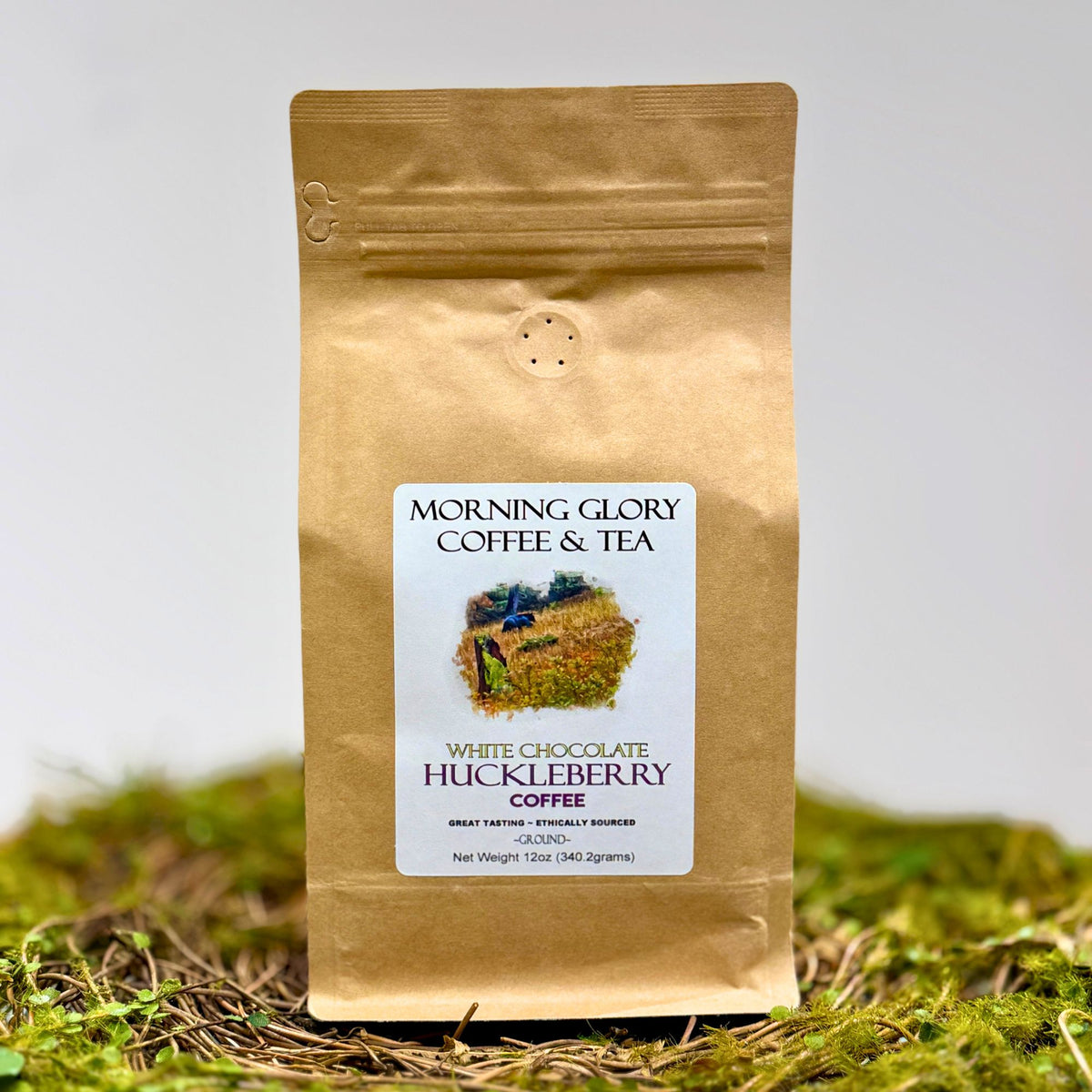 Brown Coffee Bag that's labeld White Chocolate Huckleberry Coffee Ground.