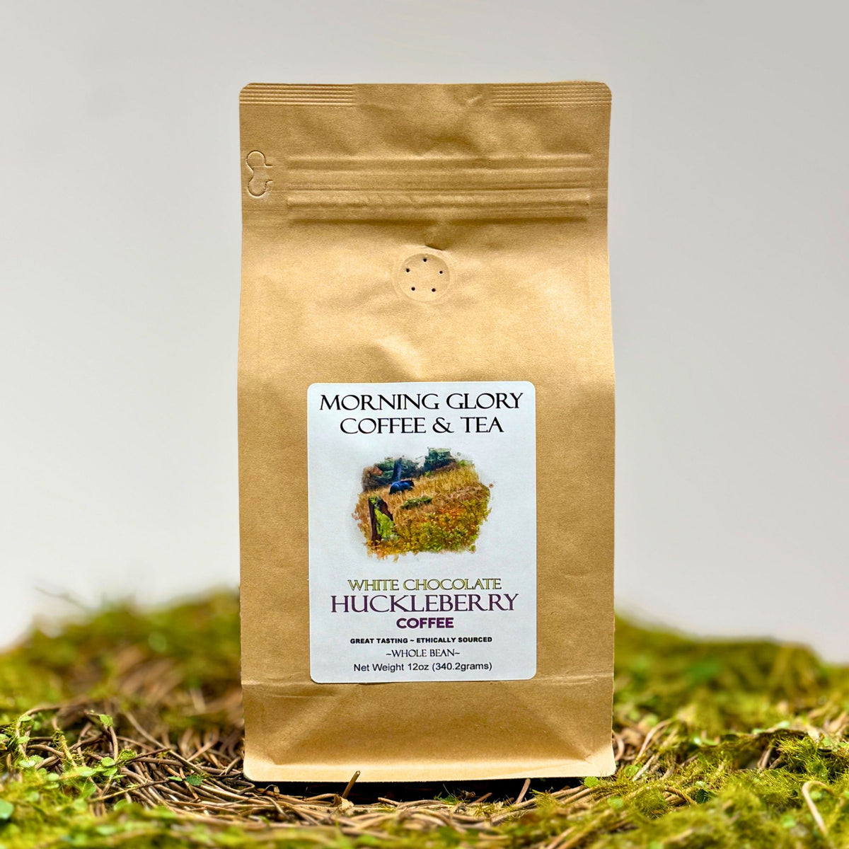 Brown Coffee Bag that's labeld White Chocolate Huckleberry Coffee Whole Bean