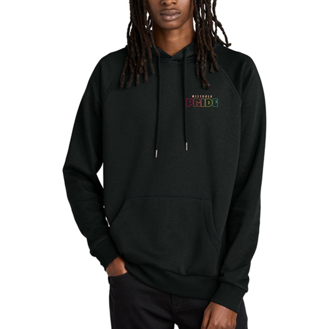Person wearing a black hoodie with colorful text reading Missoula Pride on a white background