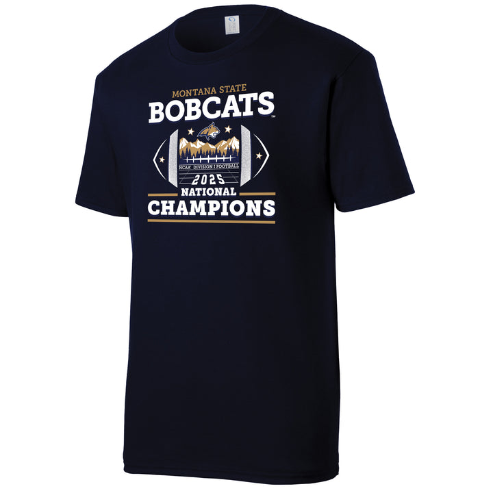 This is a short-sleeved crew neck t-shirt made of a soft navy blue fabric. The front chest features a large, smooth-textured screen print. You can feel the bold, blocky lettering of "Bobcats" at the top and "Champions" at the bottom. In the center is a detailed football-shaped graphic with a slightly raised feel, depicting sharp mountain peaks and the Bobcat mascot.