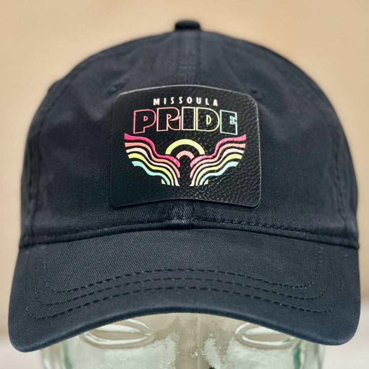 A unstructured hat with the 2026 Missoula Pride Portal leatherette patch