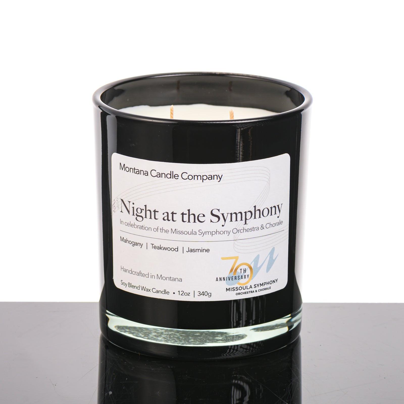 Night at the Symphony Candle (mahogany, teakwood, and jasmine scents) in a 12 oz. glass tumbler (black), made in Montana USA by Montana Candle Company