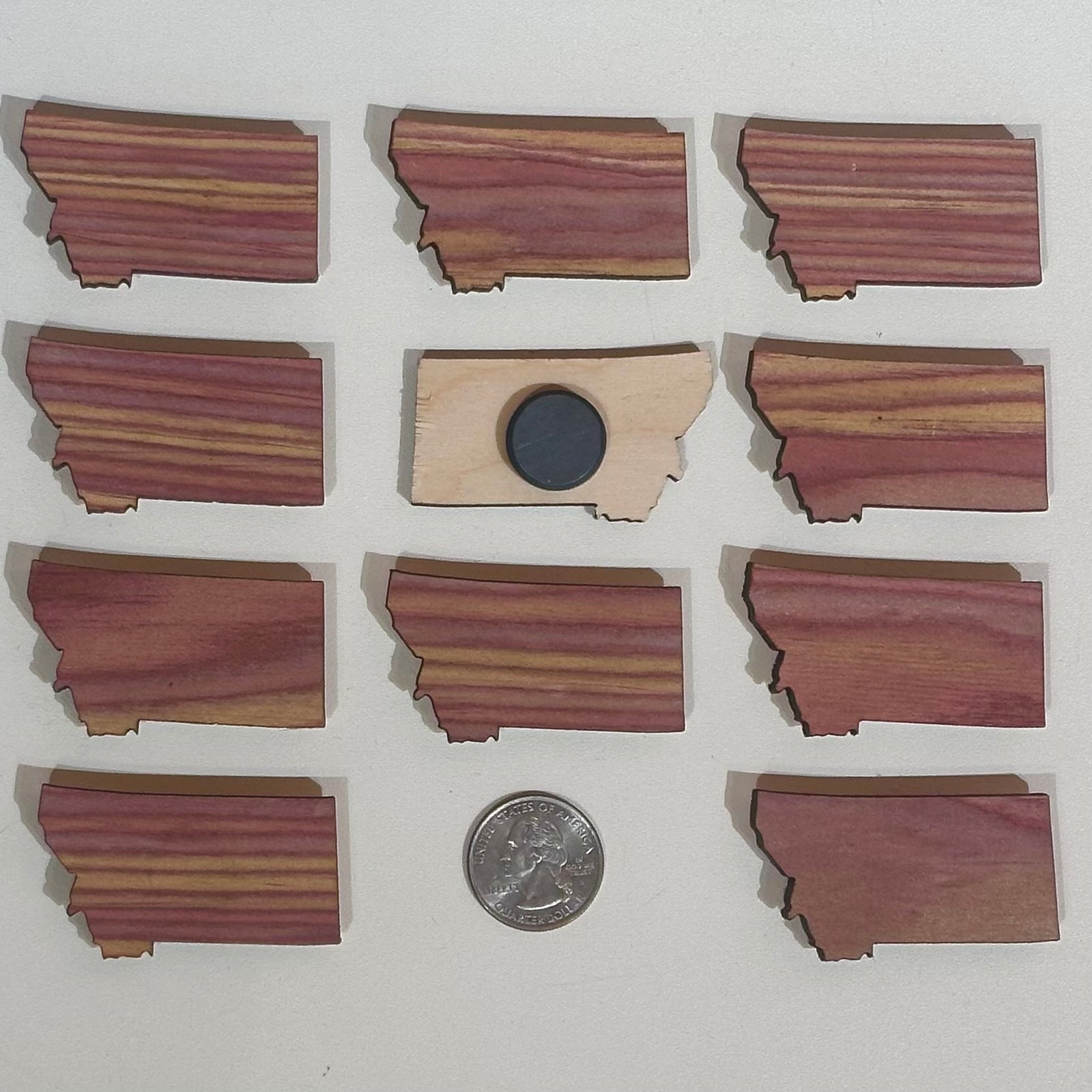 Pink striped wood magnet in the shape of Montana