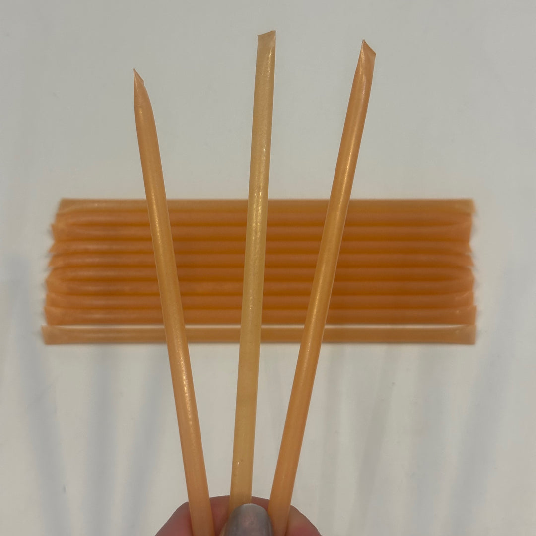 Three peach flavored honey sticks, made in montana