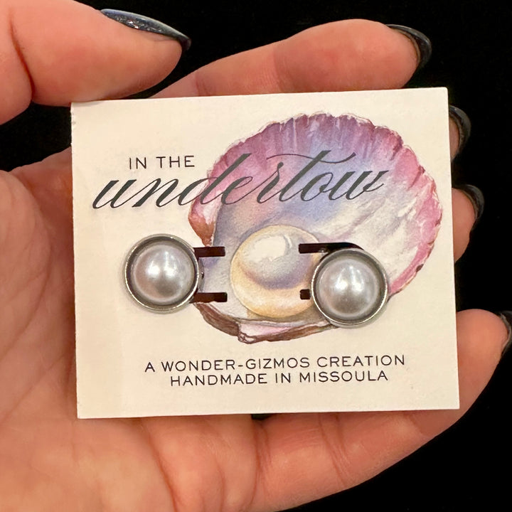 Pear and silver cuff links on a card reading  Handmade in Missoula